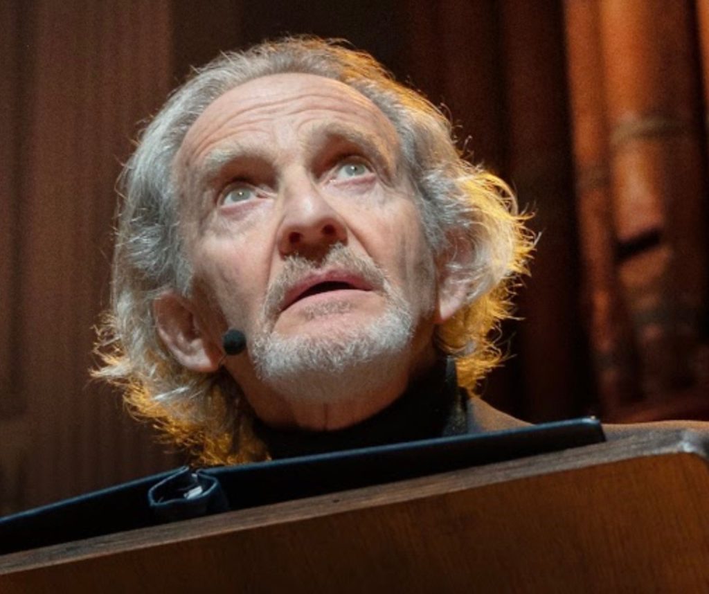 Anton Lesser looking up to the sky